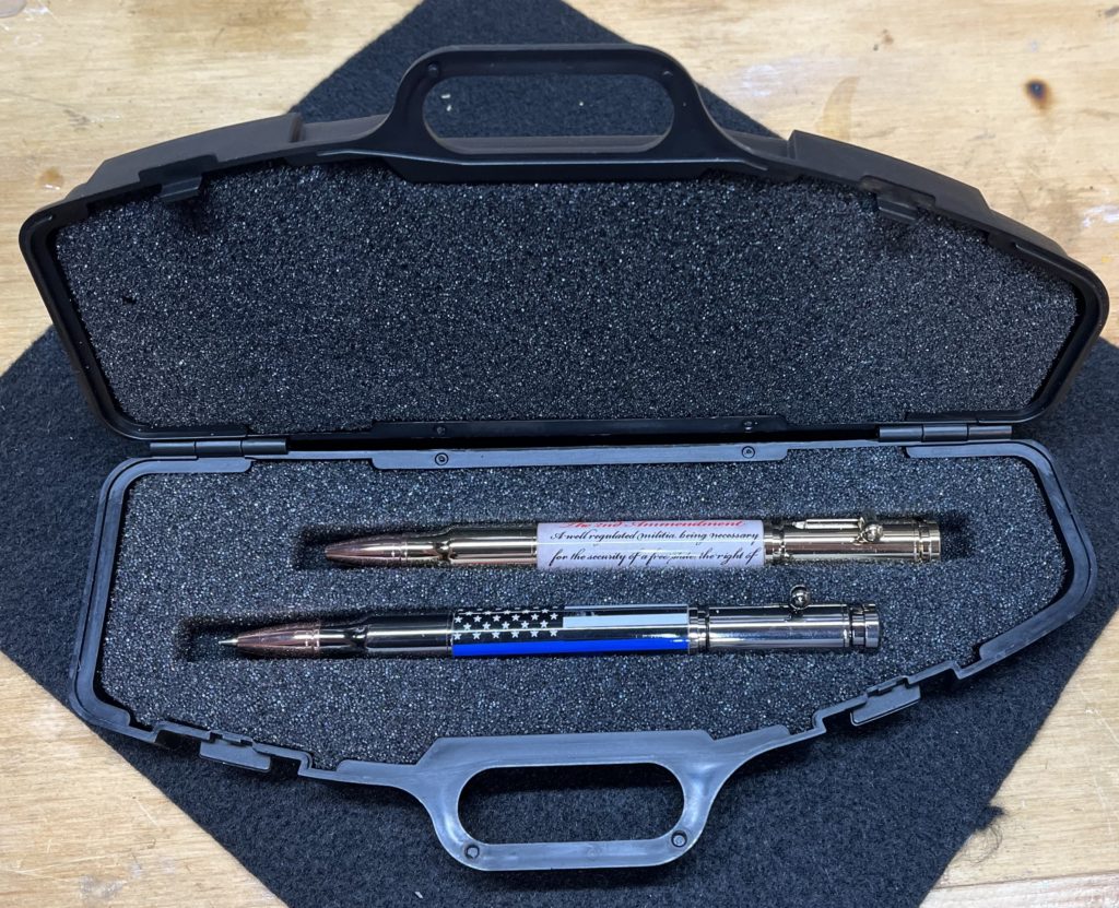 A pen and pencil set including the 2nd amendment and thin blue line.